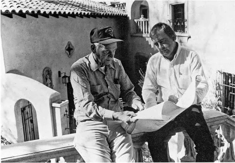 Abe Miller and Bob McIntyre reviewing blueprints